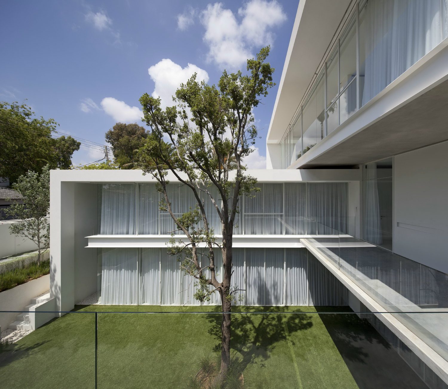 House with Two Courtyards by Pitsou Kedem Architects