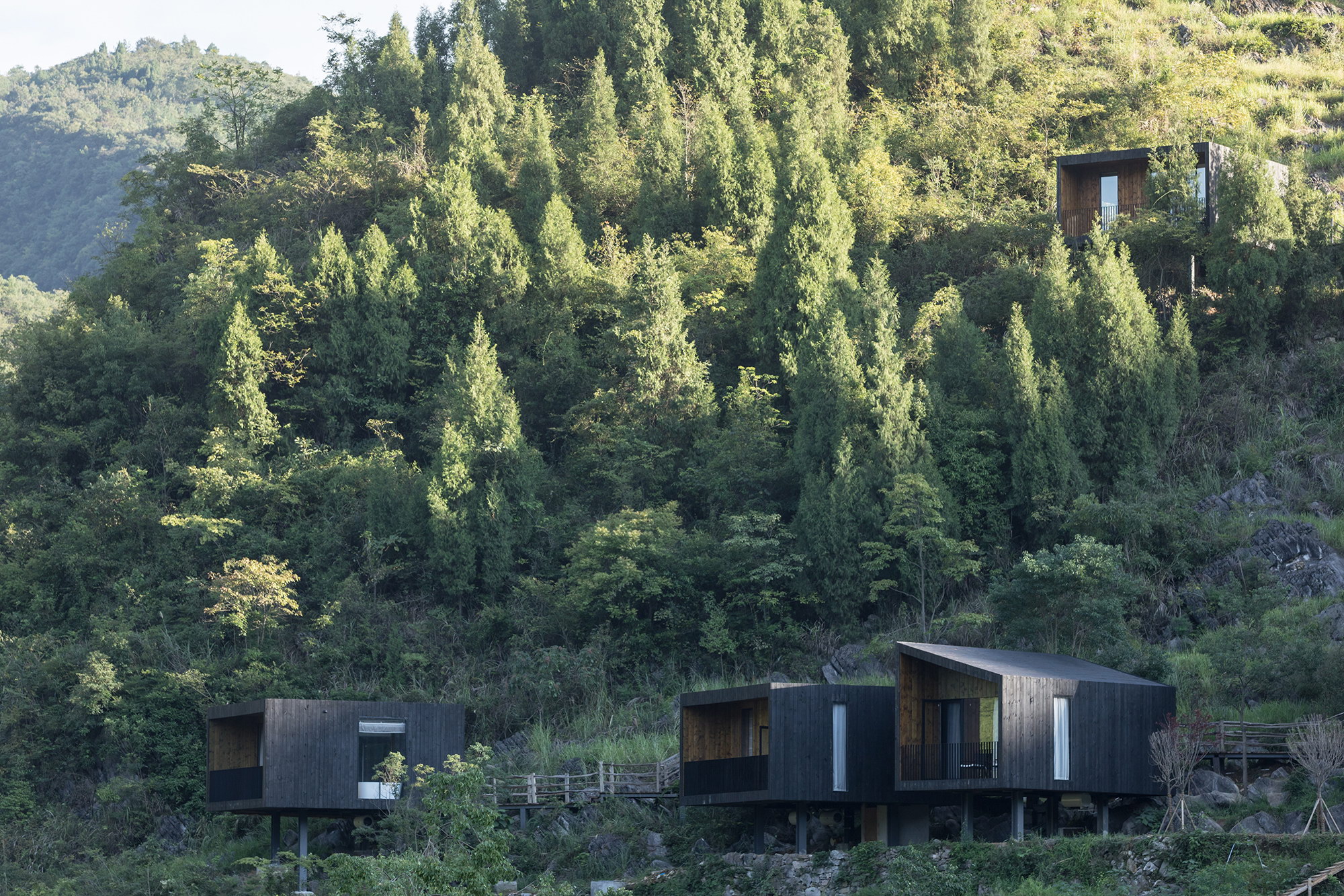 Woodhouse Hotel – Charred Timber Cabins by ZJJZ