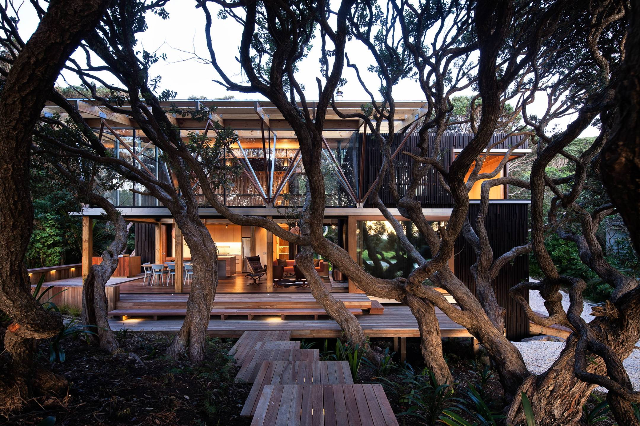 Under Pohutukawa Beach House by Herbst Architects