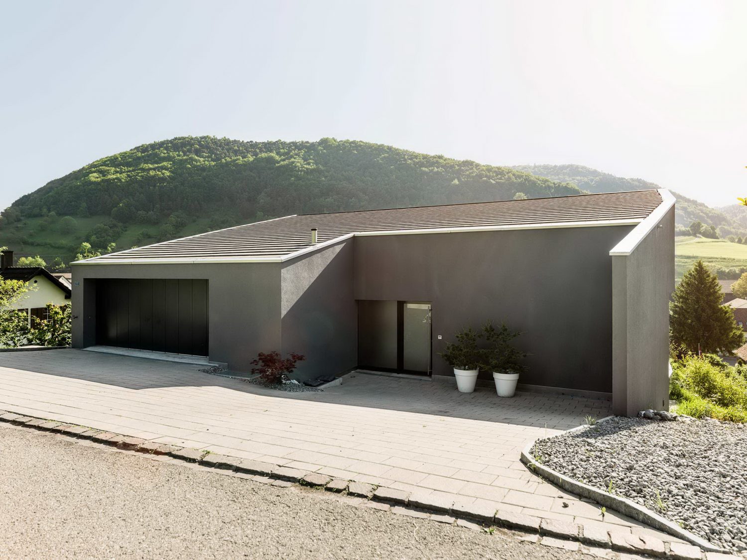 Single Family House on a Slope by Dost